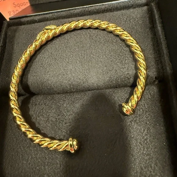 18m Gold Plated Twisted Bracelet with Simulated Diamond X Accents .